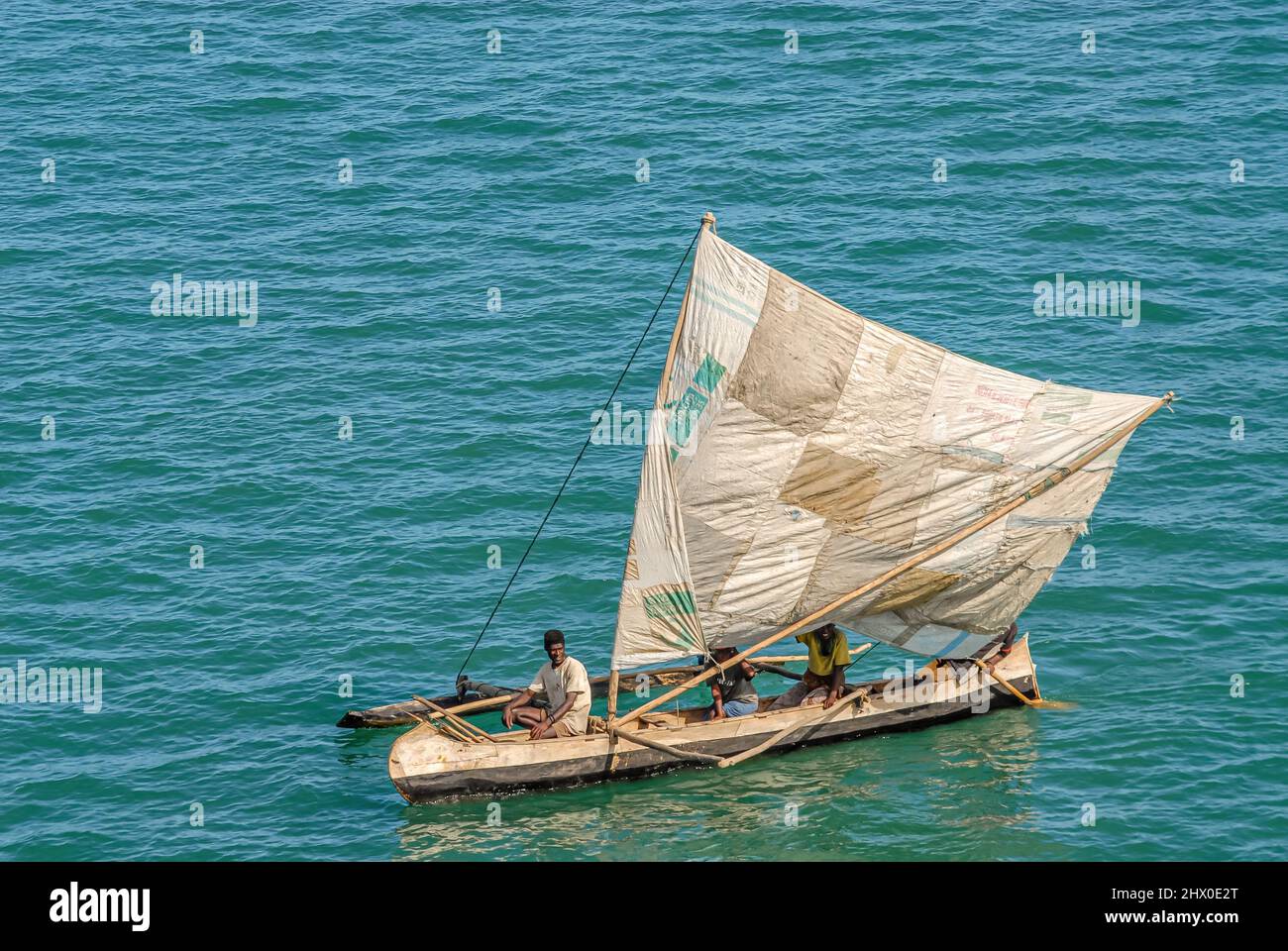 Madagascar fishermen in outrigger sailing boat on the sea, Africa Stock Photo