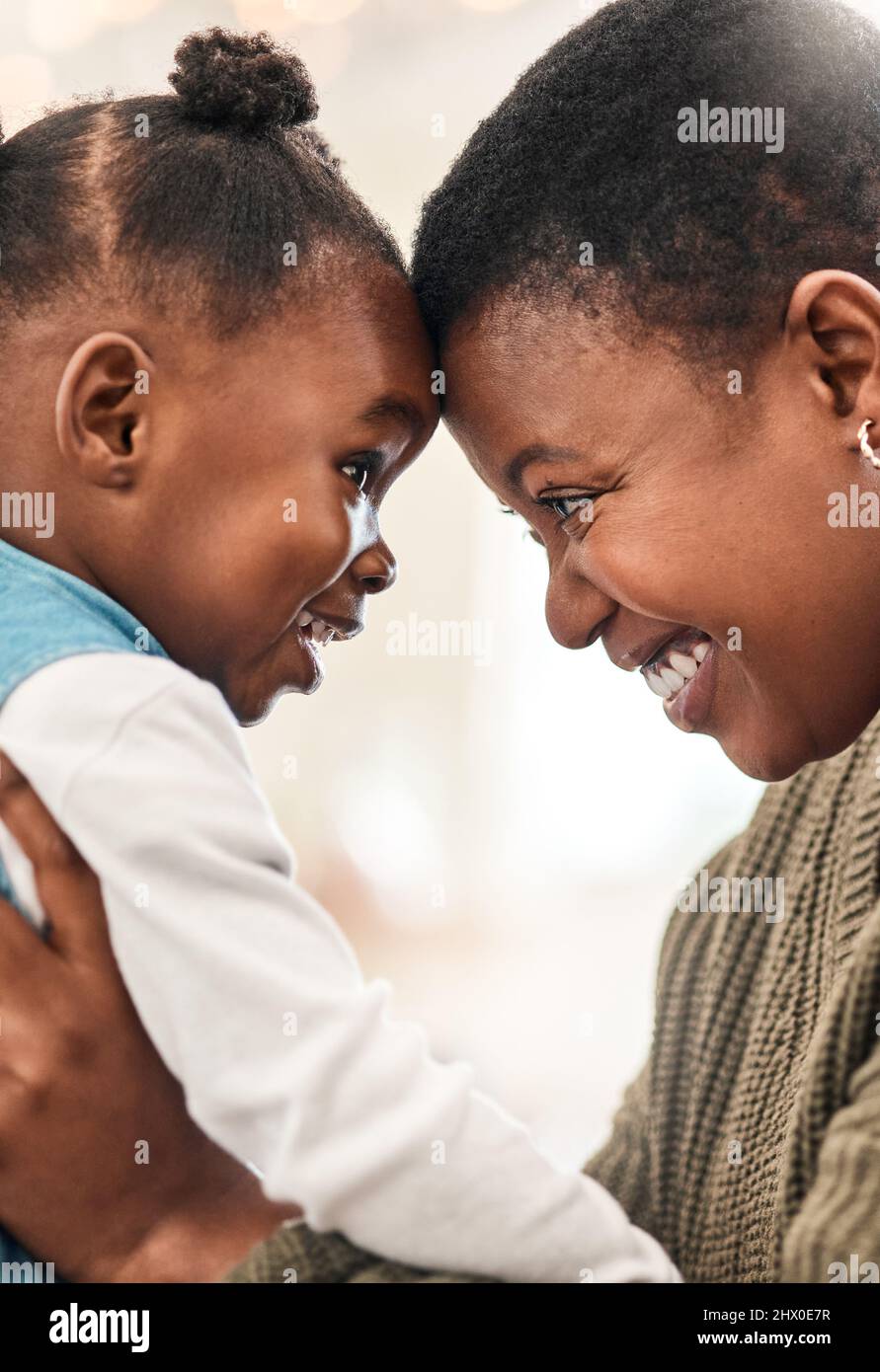 Youre loved and always will be. Shot of an adorable little girl spending quality time with her mother at home. Stock Photo