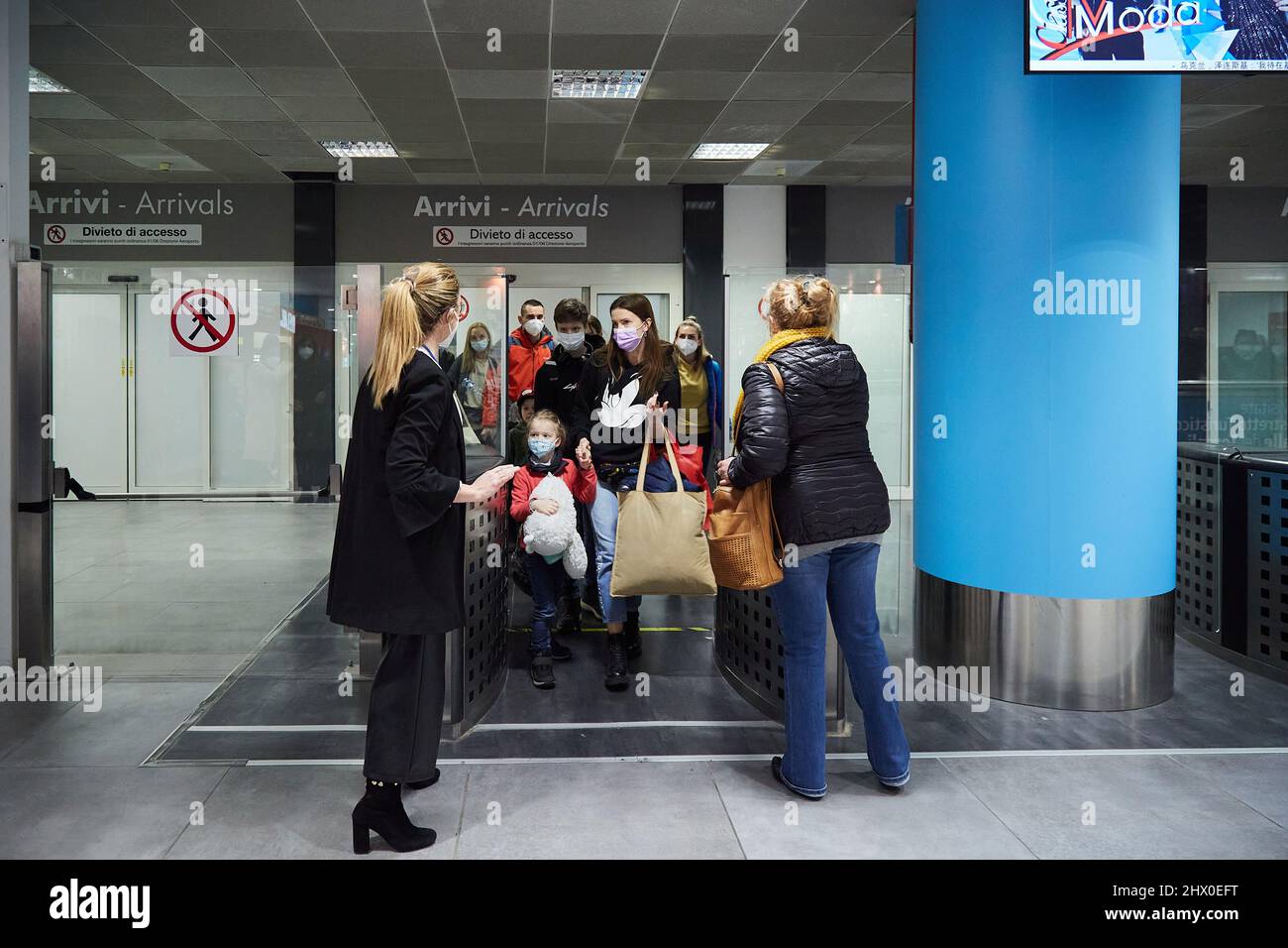Palermo, Sicily, Italy. 8th Mar, 2022. Arrival of the first Ukrainian refugees in Palermo.The flight, from Krakow, Poland, landed around 5:00 p.m. at the Falcone Borsellino airport in Punta Raisi, Palermo.Upon arrival, refugees, welcomed by relatives and UNHCR volunteers, have carried out the anti-COVID protocol before leaving the airport. (Credit Image: © Victoria Herranz/ZUMA Press Wire) Stock Photo