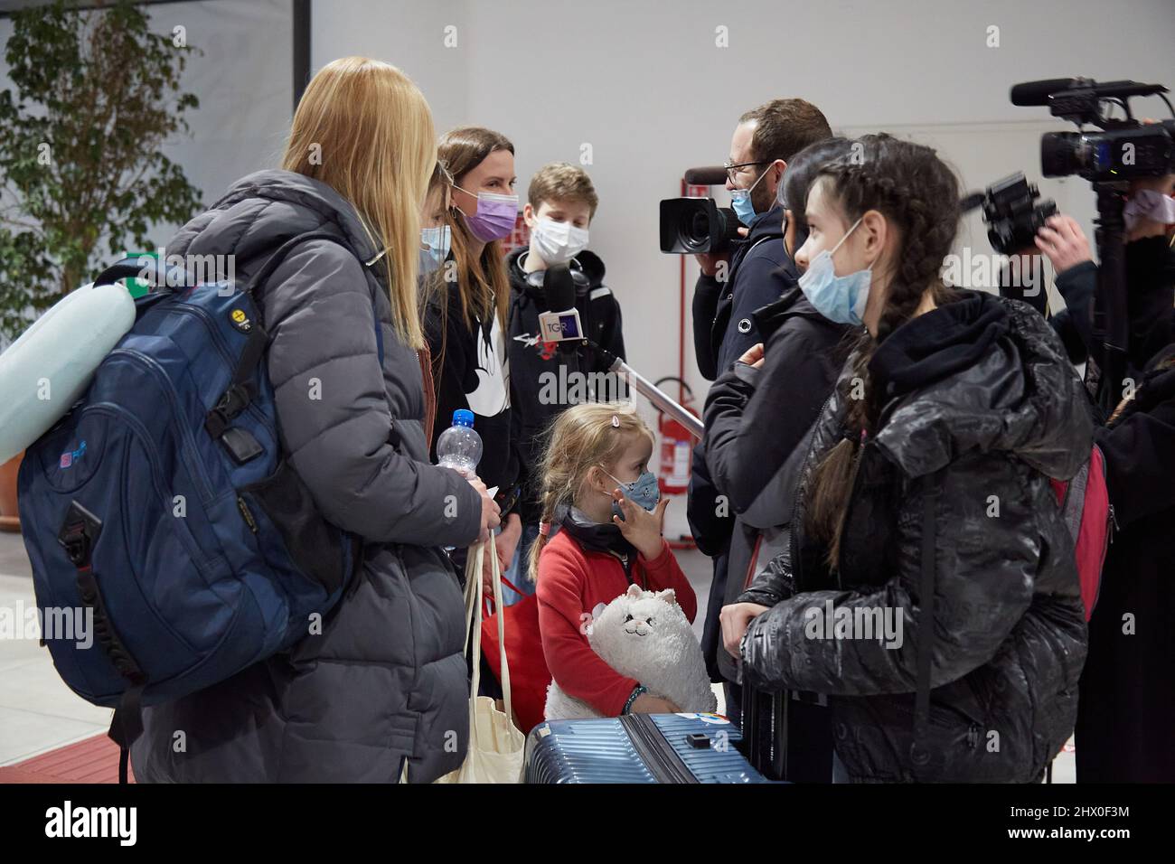 Palermo, Sicily, Italy. 8th Mar, 2022. Arrival of the first Ukrainian refugees in Palermo.The flight, from Krakow, Poland, landed around 5:00 p.m. at the Falcone Borsellino airport in Punta Raisi, Palermo.Upon arrival, refugees, welcomed by relatives and UNHCR volunteers, have carried out the anti-COVID protocol before leaving the airport. Ukrainian family attends the press. (Credit Image: © Victoria Herranz/ZUMA Press Wire) Stock Photo