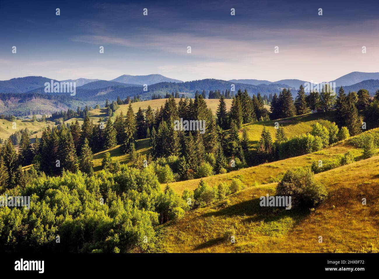 Great view of the alpine valley that glowing by sunlight. Picturesque and gorgeous morning scene. Popular tourist attraction. Location place Carpathia Stock Photo