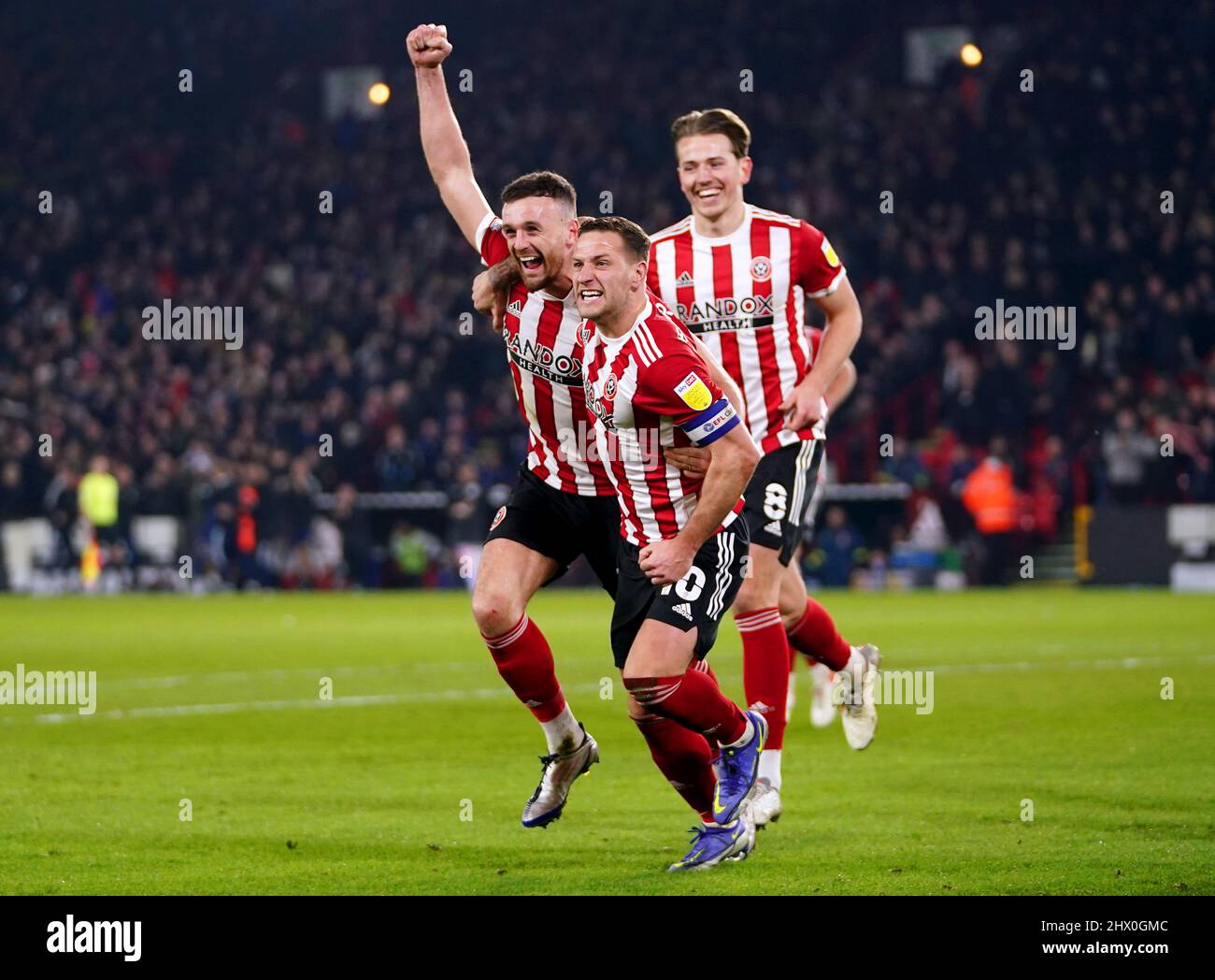 Sheffield United's Jack Robinson (left) celebrates scoring their side's third goal of the game during the Sky Bet Championship match at Bramall Lane, Sheffield. Picture date: Tuesday March 8, 2022. Stock Photo