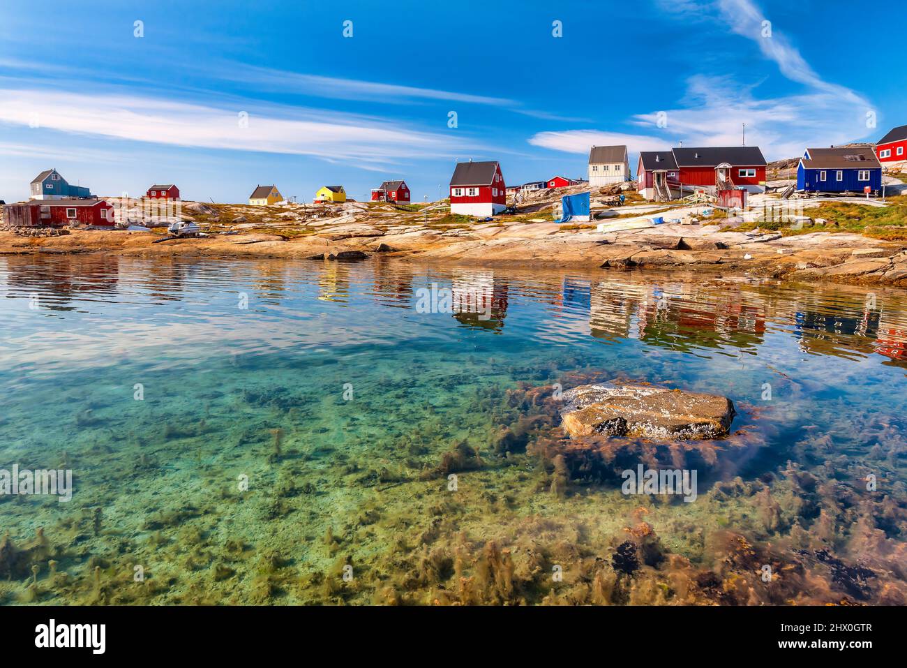 The colorful houses of Rodebay, Greenland. This settlement is located on a small peninsula jutting off the mainland into eastern Disko Bay Stock Photo