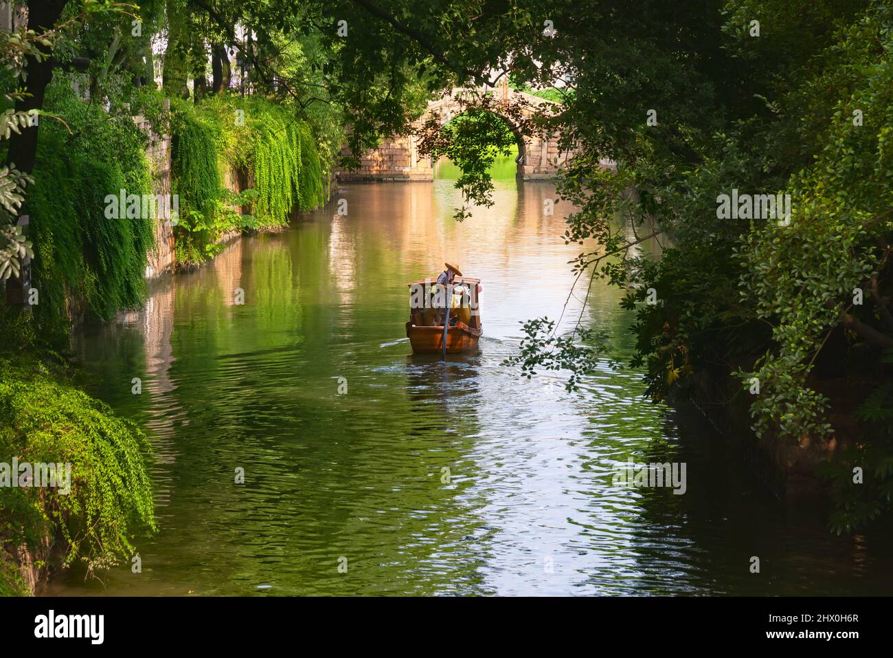Suzhou, China - August 08, 2011: View of a canal in Tiger Hill Park. This park is a popular tourist destination and is known for its natural beauty Stock Photo