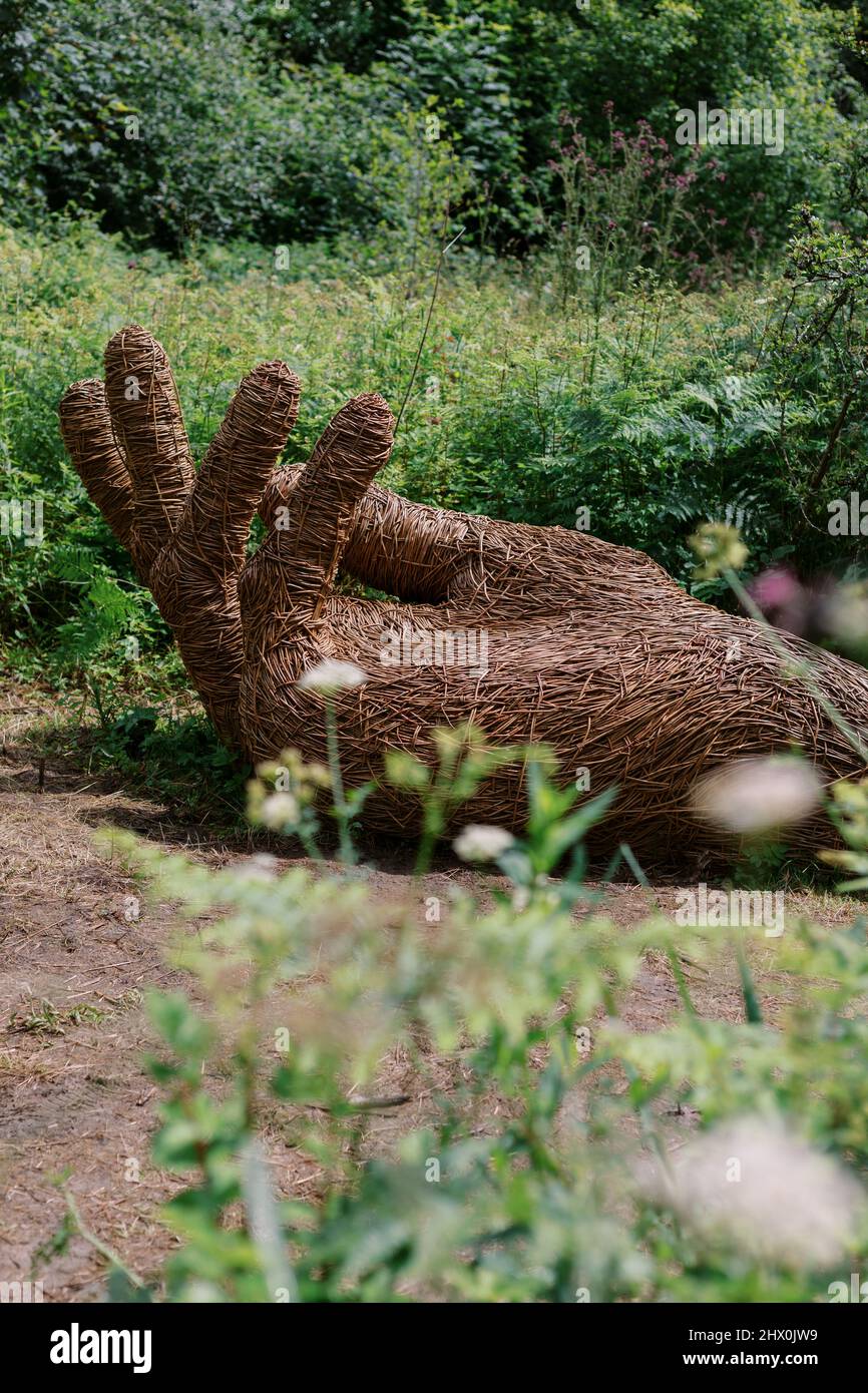 'In Nature's Hand' sculpture by Jasmine Fassenfelt and Rebecca Knight, Lost Gardens of Heligan, Cornwall, England, UK Stock Photo