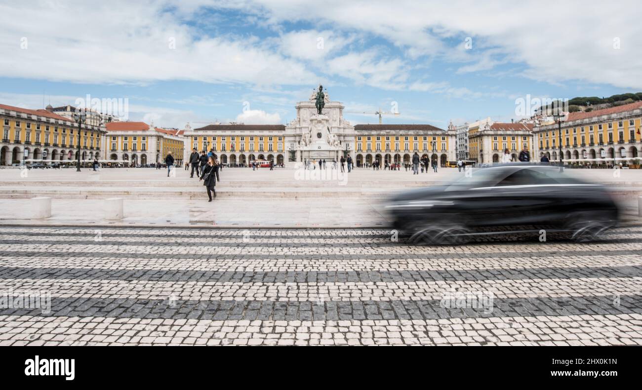 Long exposure of a car travelling through the tiled road of Stock Photo