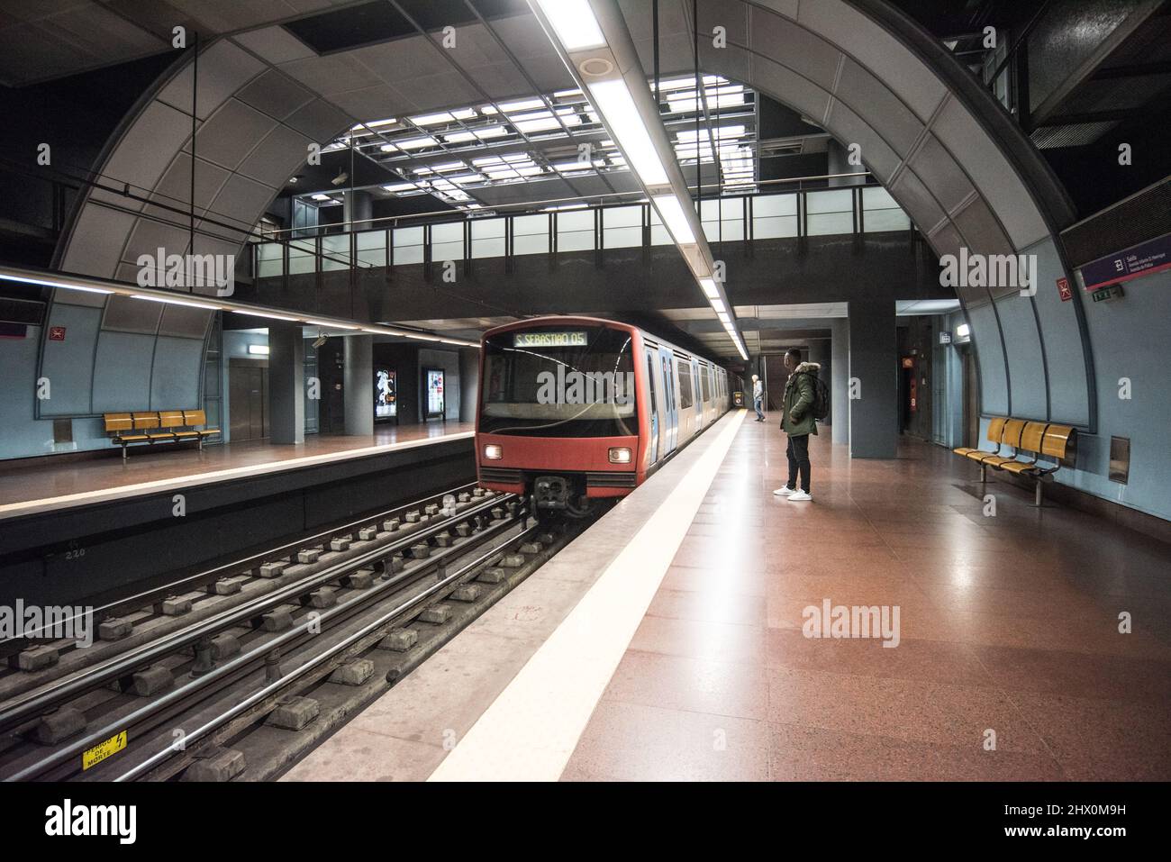 Interior Shot of Lisbon Metro, with a train pulling up into the station Stock Photo