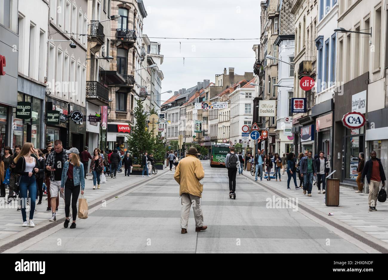 Ixelles, Brussels Capital Region - Belgium - 06 22 2020 - People walking and driving the bicycle in the shopping street Stock Photo