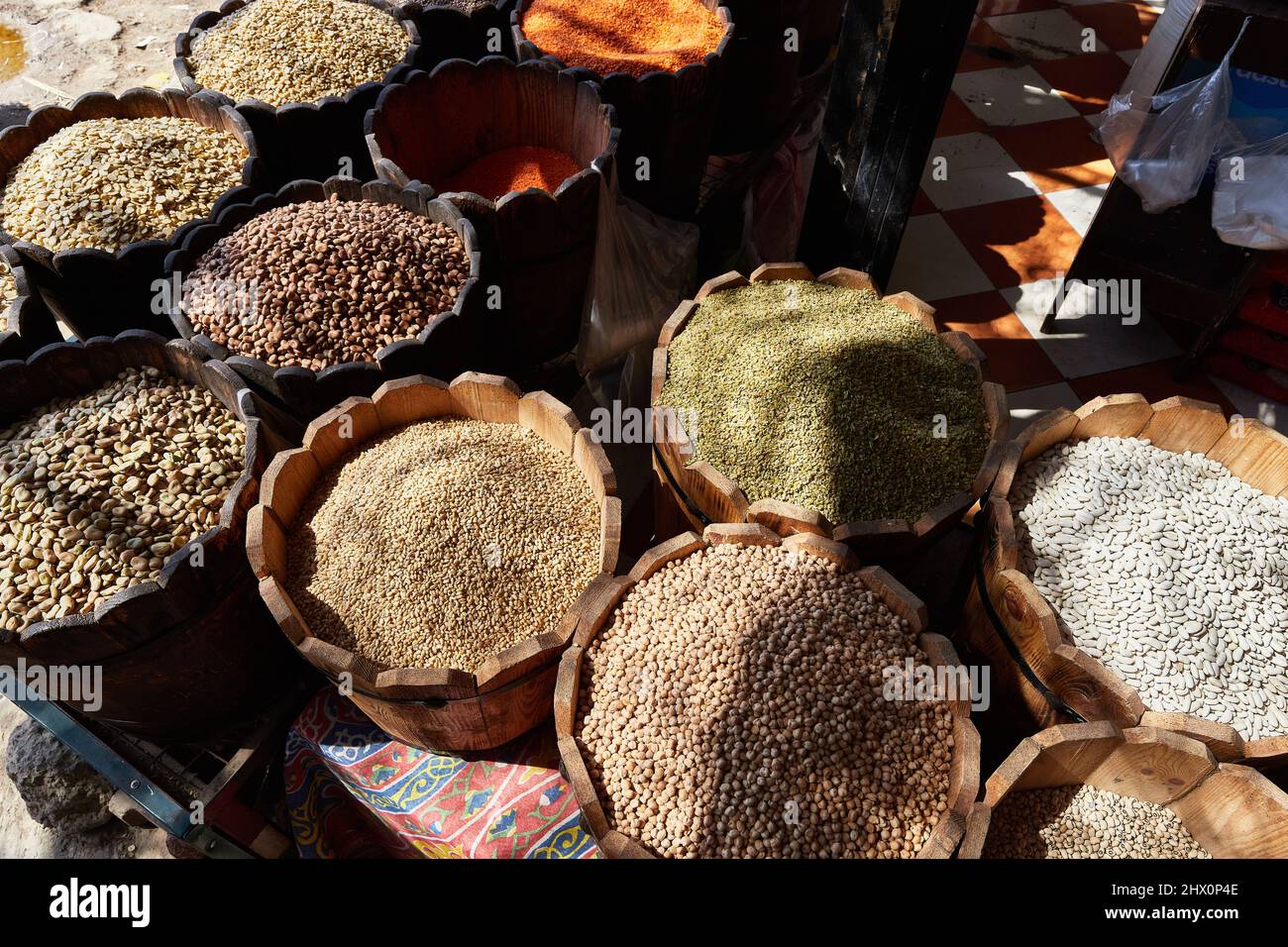 Variety organic groats in barrel on sale on a farmers market