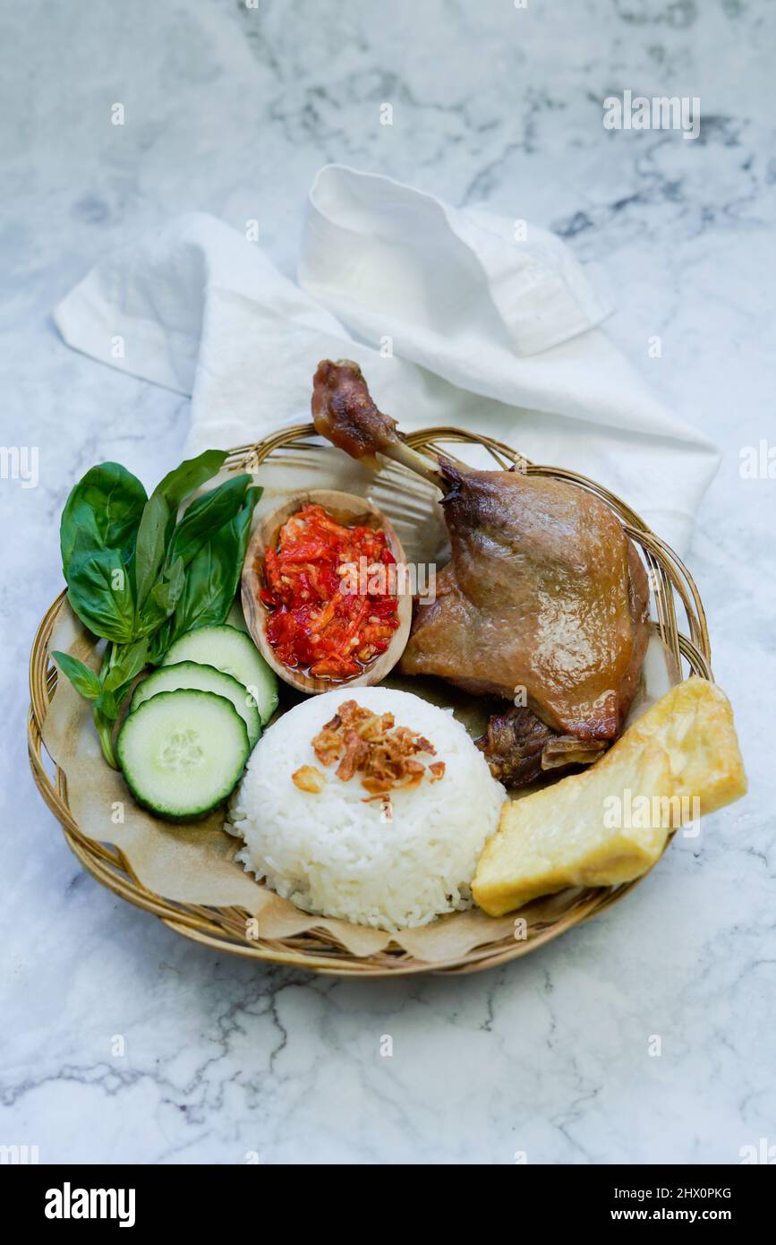 Bebek Goreng. Indonesian Street Food Of Deep-fried Duck Served With ...