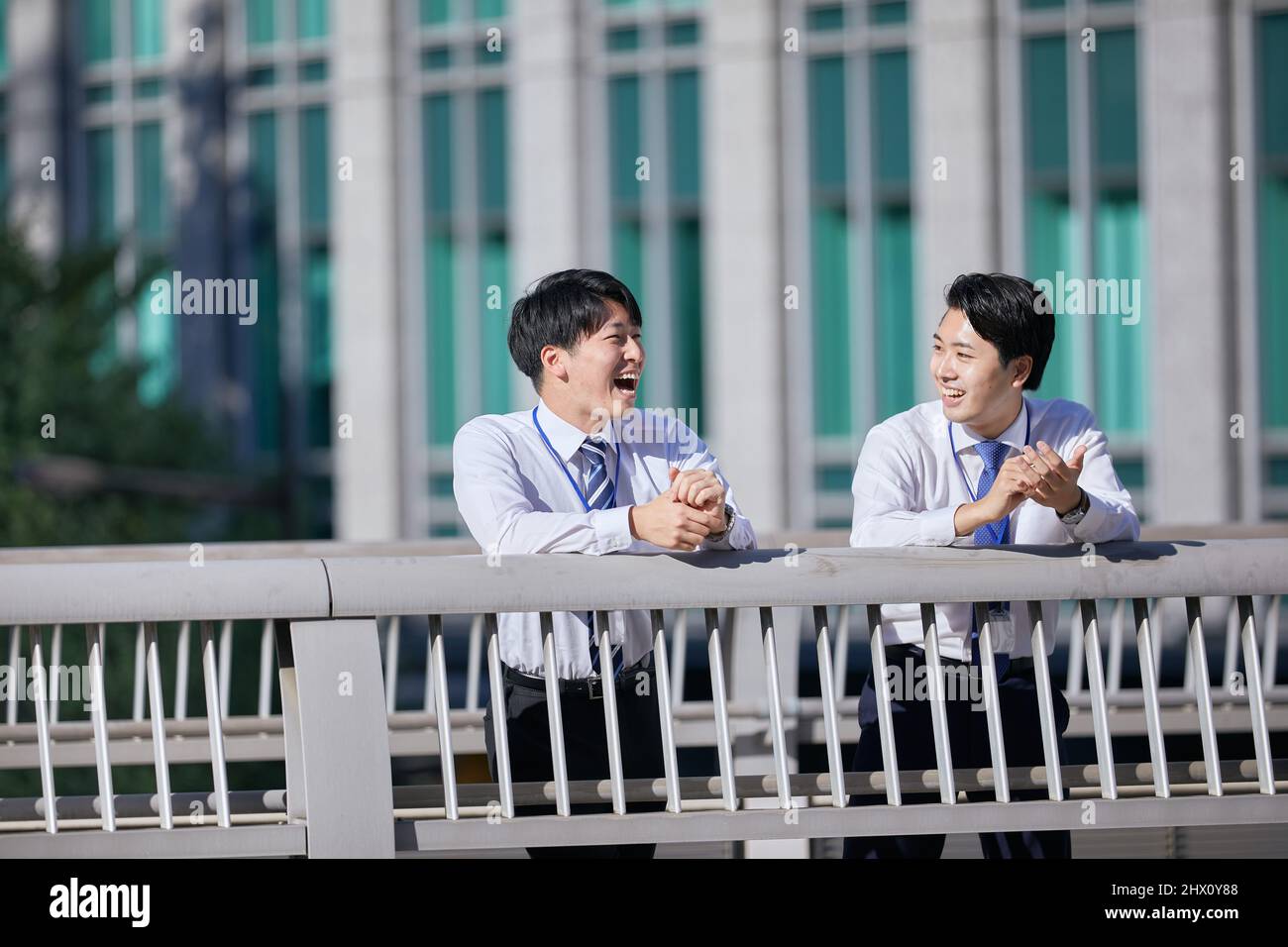 Japanese Businessmen Chatting Stock Photo