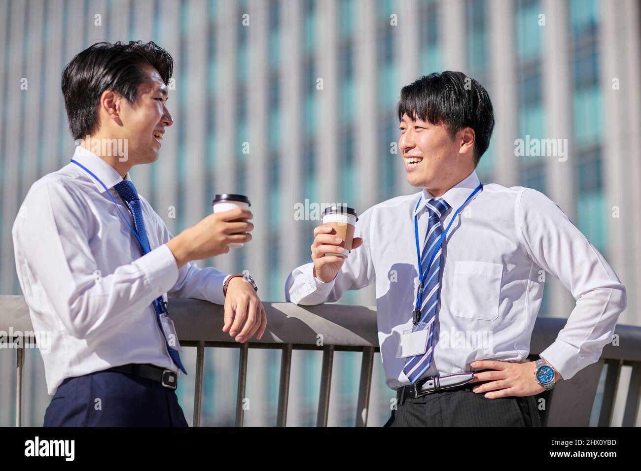 Japanese Businessmen Chatting Stock Photo