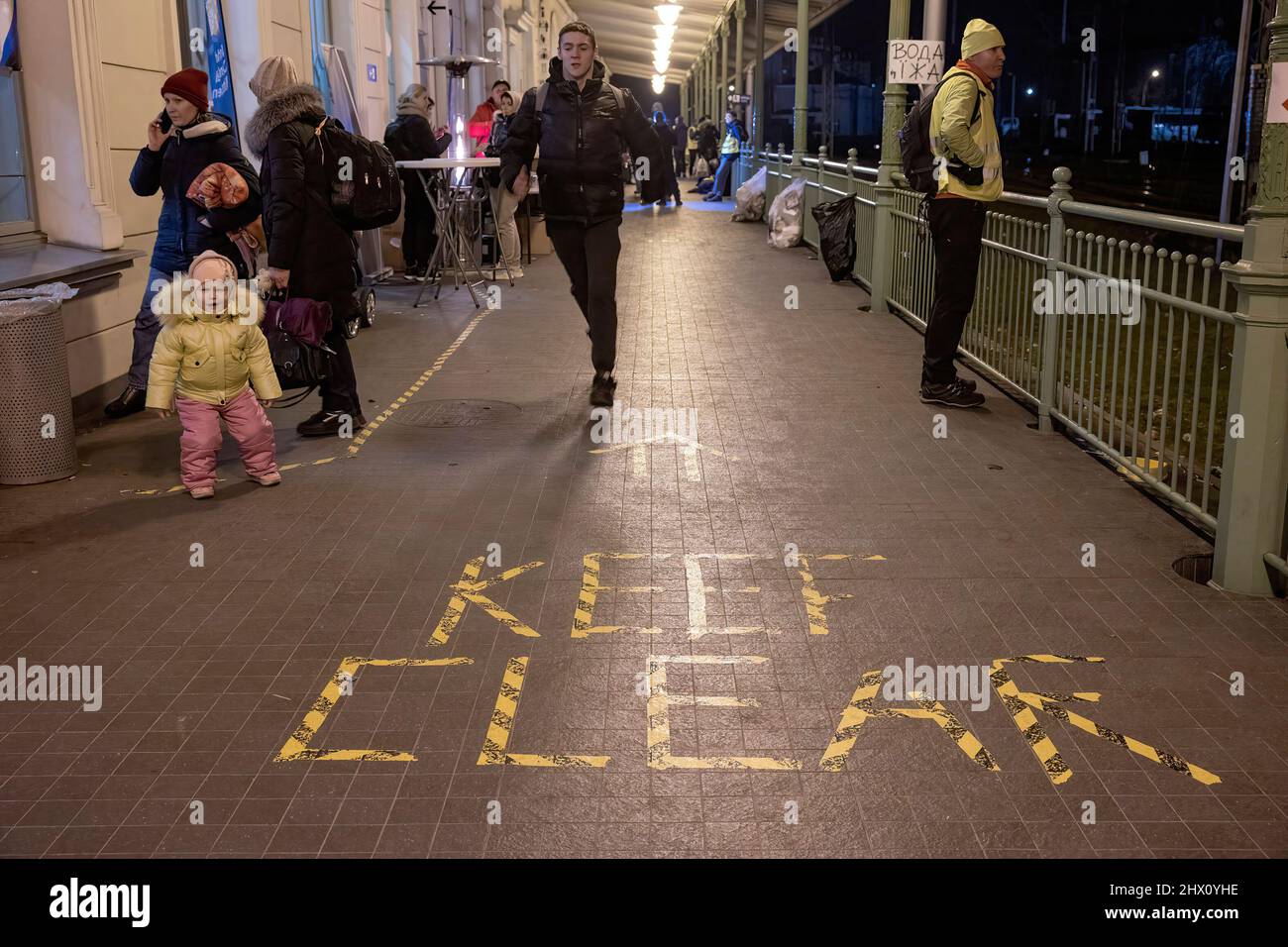 Przemysl, Poland. 08th Mar, 2022. A view of the 'Keep Clear' sign on the floor at Przemysl train station. More than 1.5 millions Ukrainians have fled from their country to Poland due to the Russian invasion, according to the latest figures from United Nations High Commissioner for Refugees (UNHCR). Credit: SOPA Images Limited/Alamy Live News Stock Photo