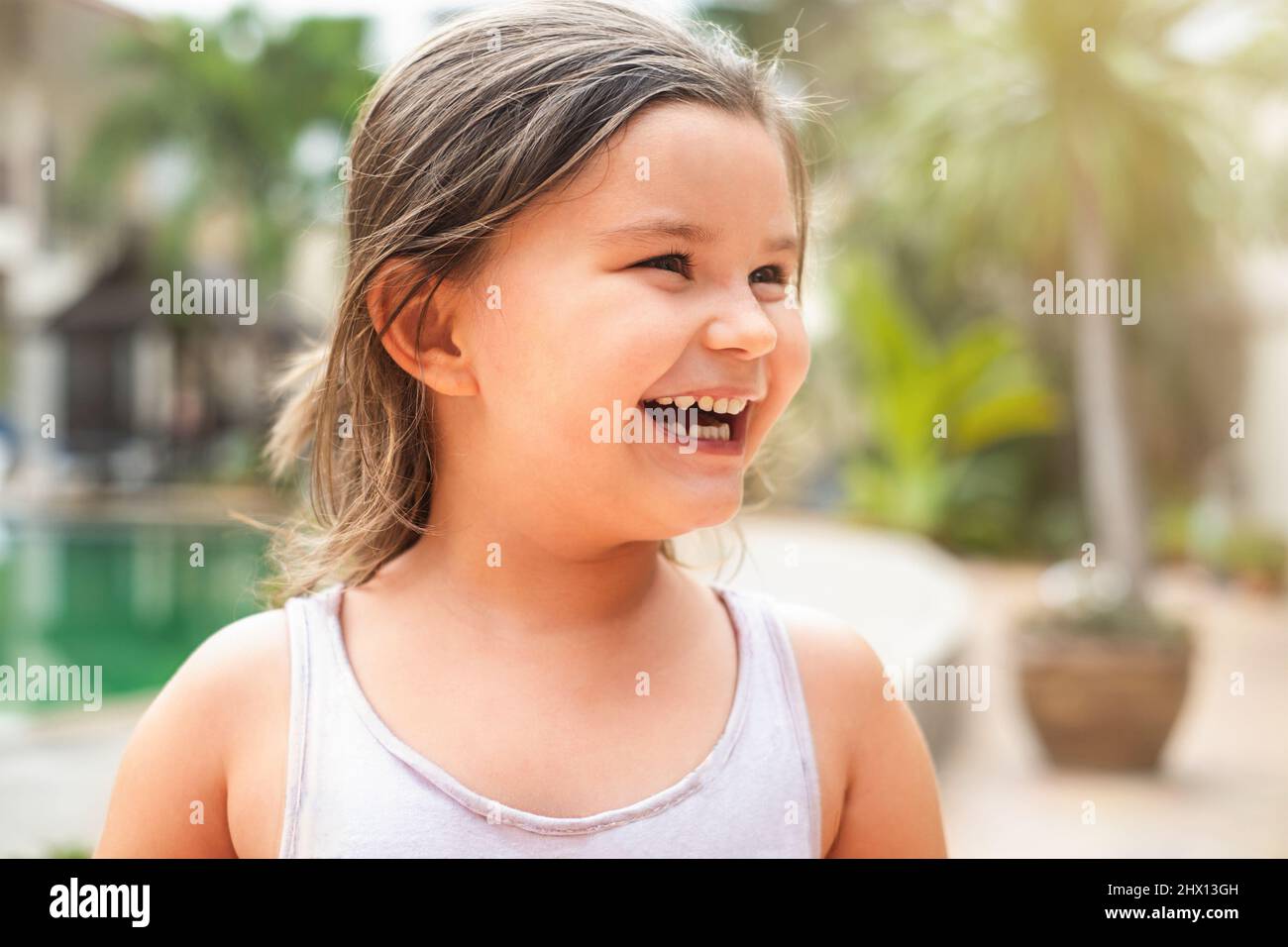 Portrait of happy child smiling and looking away outdoor Stock Photo