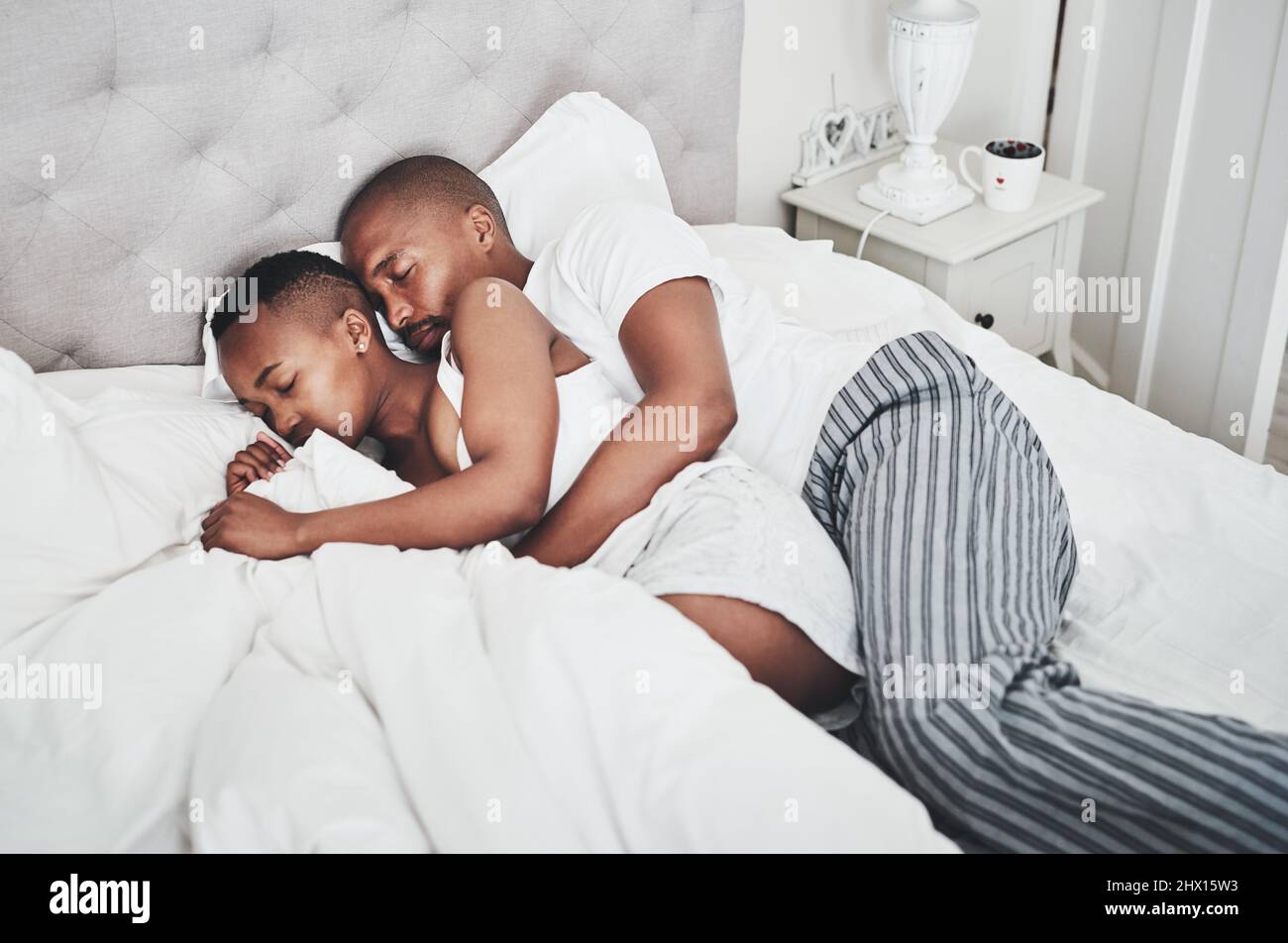 African couple sleeping in bed hi-res stock photography and images - Alamy