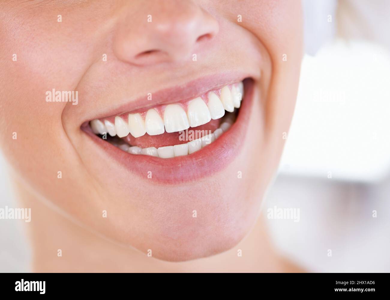 A brilliant display of pearly whites. Close up of a womans sparkling teeth. Stock Photo
