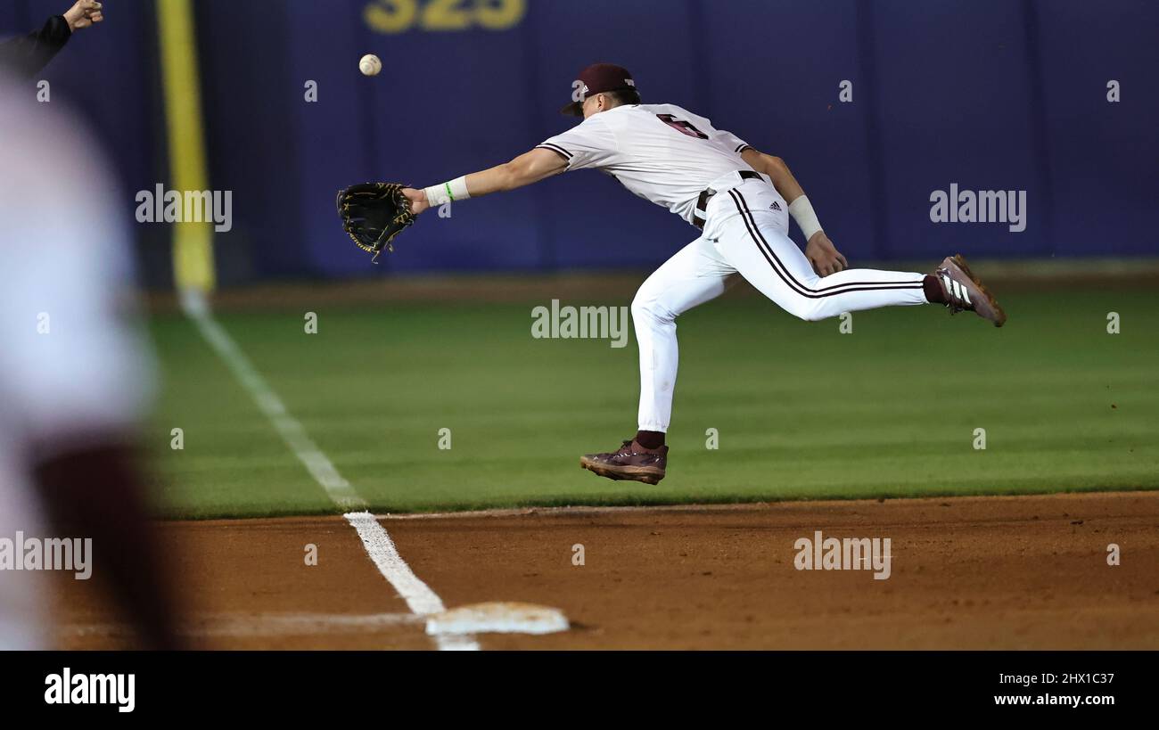 Biloxi, Mississippi. US, Mar 08, 2022: Biloxi, Mississippi, USA. 08th Mar, 2022. Mississippi State Bulldogs infielder Kamren James (6) stretches to try and stop a ball hit down the line during game one of the Hancock-Whitney Classic college baseball series, between the Texas Tech Red Raiders and the Mississippi State Bulldogs at MGM Park in Biloxi, Mississippi. Bobby McDuffie/CSM/Alamy Live News Stock Photo