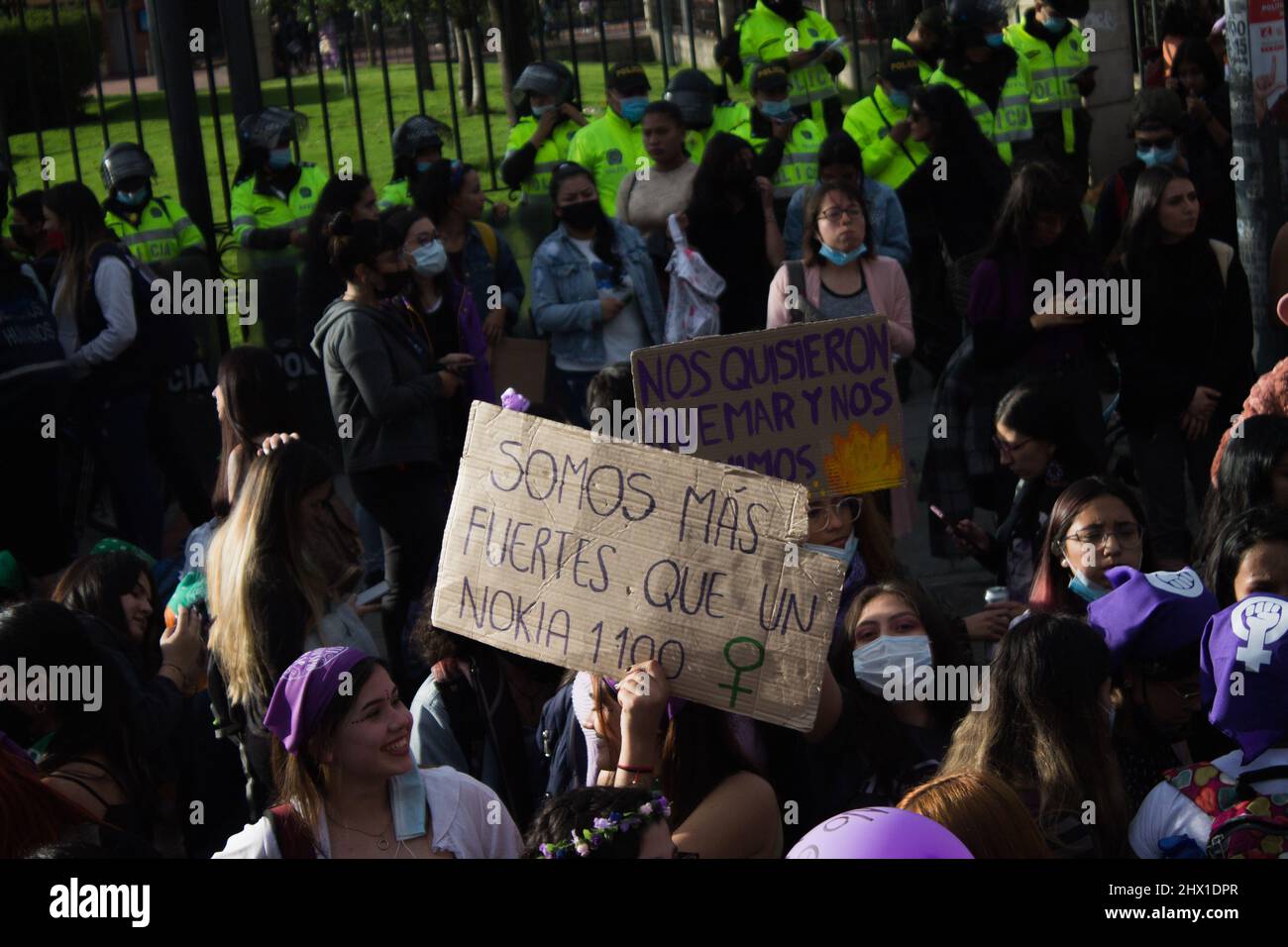 Bogota, Colombia on March 8, 2022. A demonstrator holds a sign that reads 'We are stronger than a Nokia 1100' as women participate in the international womes day demonstrations in Bogota, Colombia on March 8, 2022. Stock Photo