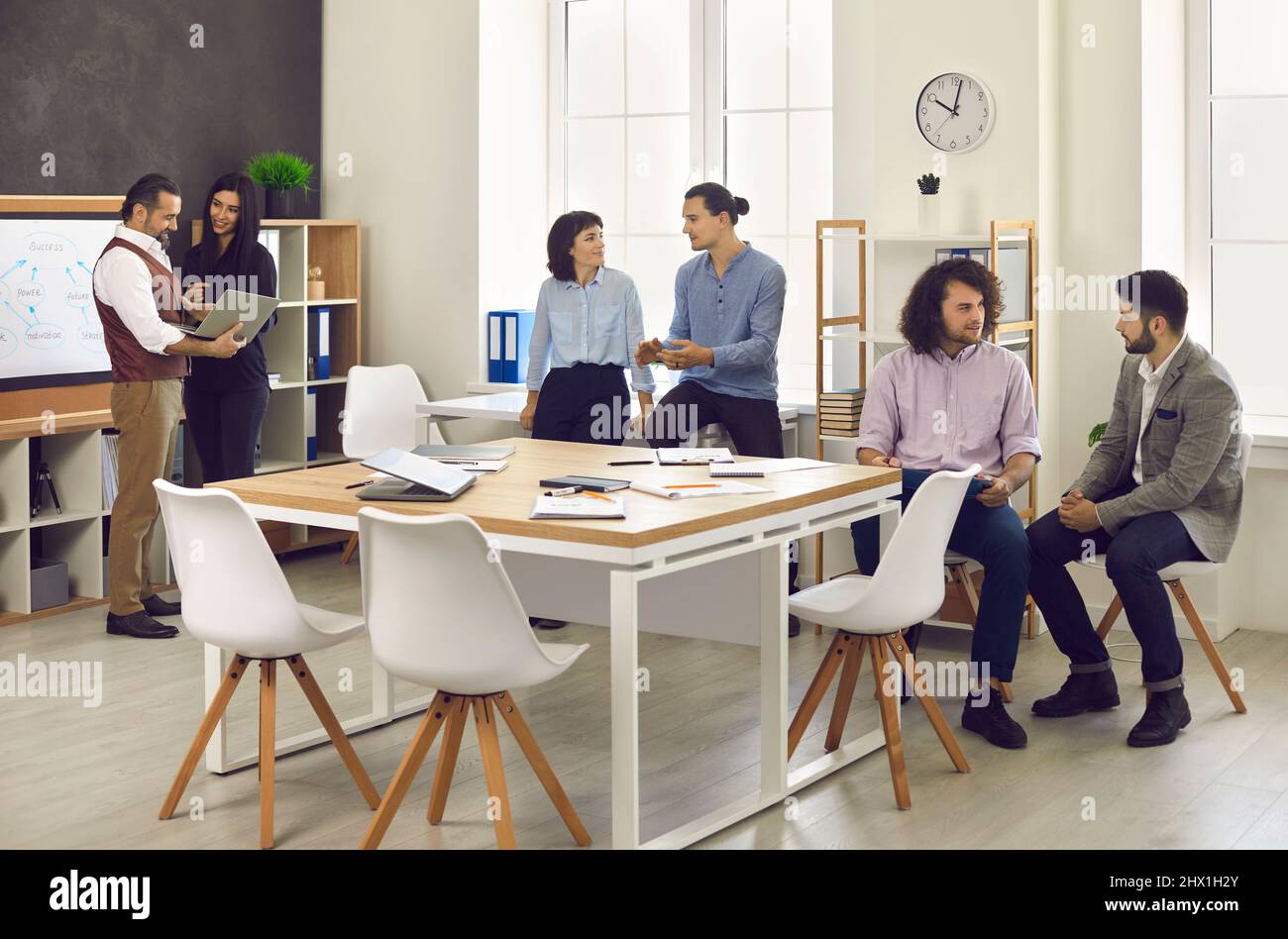 Business people or company employees meet up and work together in a modern office Stock Photo