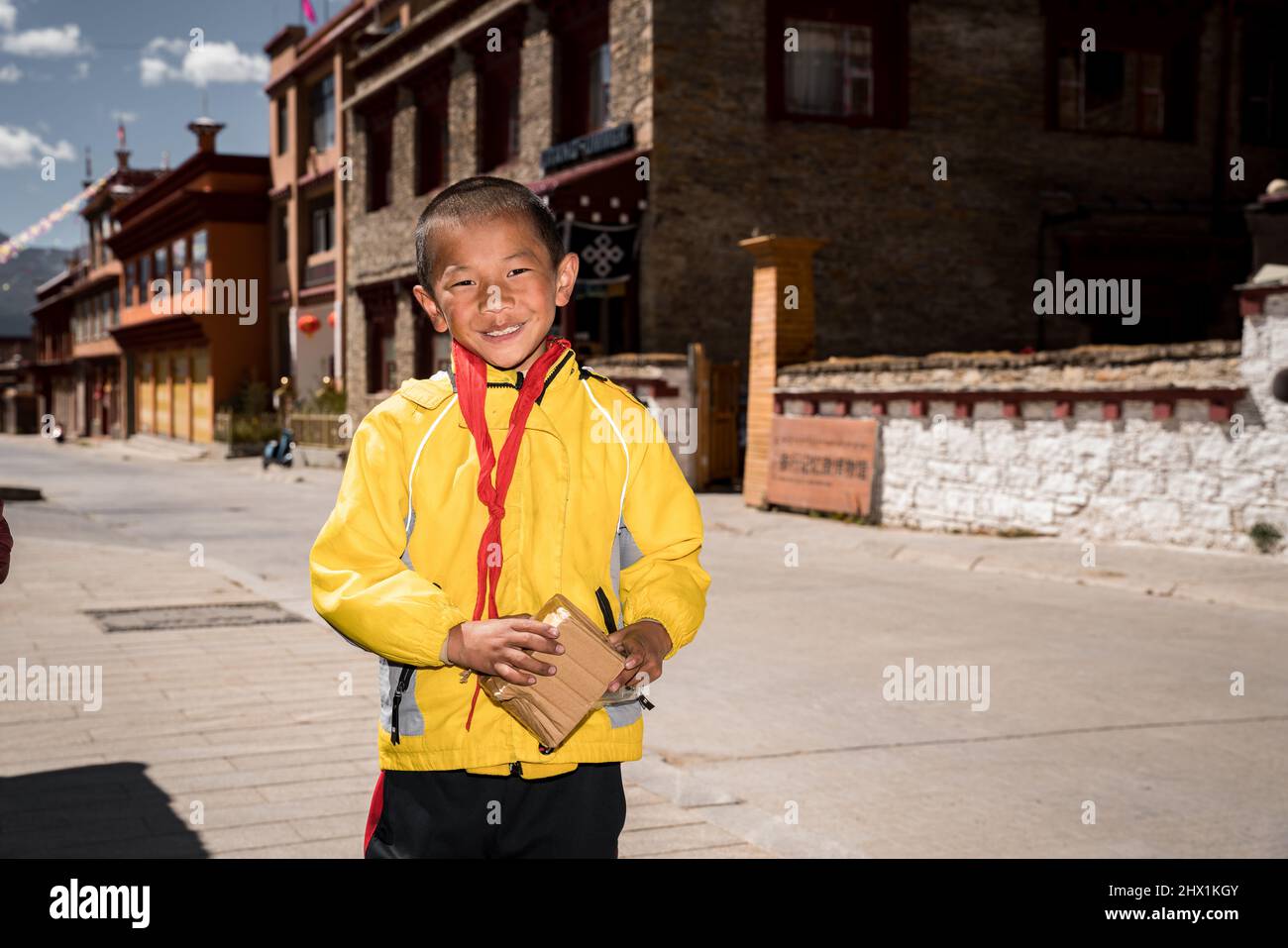 Litang, Garze, China: Portrait of young tibetan students on the street of Litang. Stock Photo