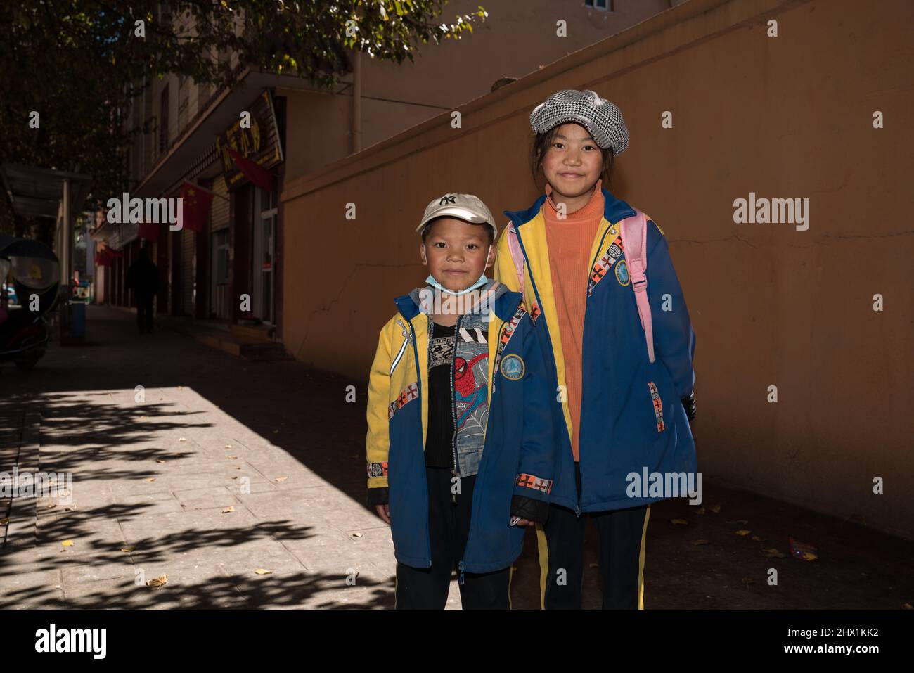 Litang, Garze, China: Portrait of young tibetan students on the street of Litang. Stock Photo