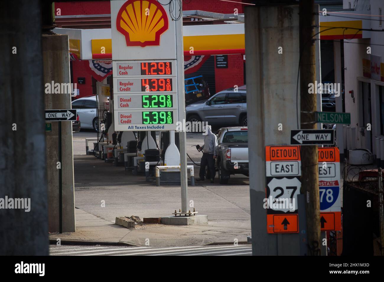 New York, USA. 8th Mar, 2022. A person pumps gas at a gas station in the Brooklyn borough of New York, the United States, on March 8, 2022. The U.S. national average for a gallon of regular gasoline hit a fresh record high of 4.173 dollars on Tuesday, according to data from the American Automobile Association. The national average gas price has jumped 55 cents over the past week, following a surge in oil prices and surpassing the previous record of 4.114 dollars a gallon set in July 2008. The current record does not account for inflation. Credit: Michael Nagle/Xinhua/Alamy Live News Stock Photo