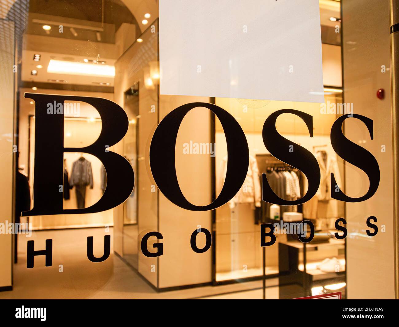 Moscow, Russia. 08th Mar, 2022. Hugo Boss logo seen on the doors of a  closed boutique. Major international premium brands have ceased their  activities in Russia, their stores are closed. Credit: SOPA