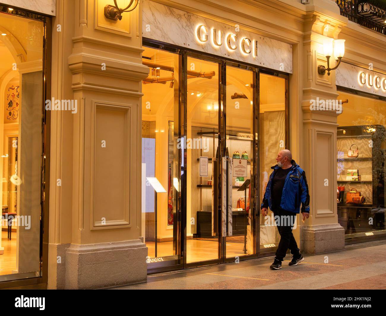 A man walks past a closed Gucci boutique. Major international premium  brands have ceased their activities in Russia, their stores are closed.  (Photo by Alexander Sayganov / SOPA Images/Sipa USA Stock Photo -
