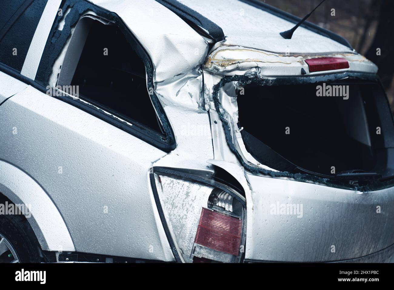 Deteriorated rear end of a urban hatchback car crashed. High quality photo Stock Photo