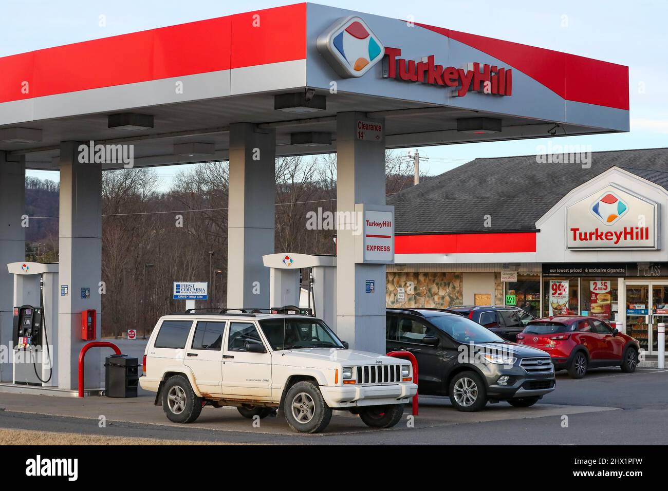 Cars are seen filling up at a Turkey Hill gas station. AAA reported the