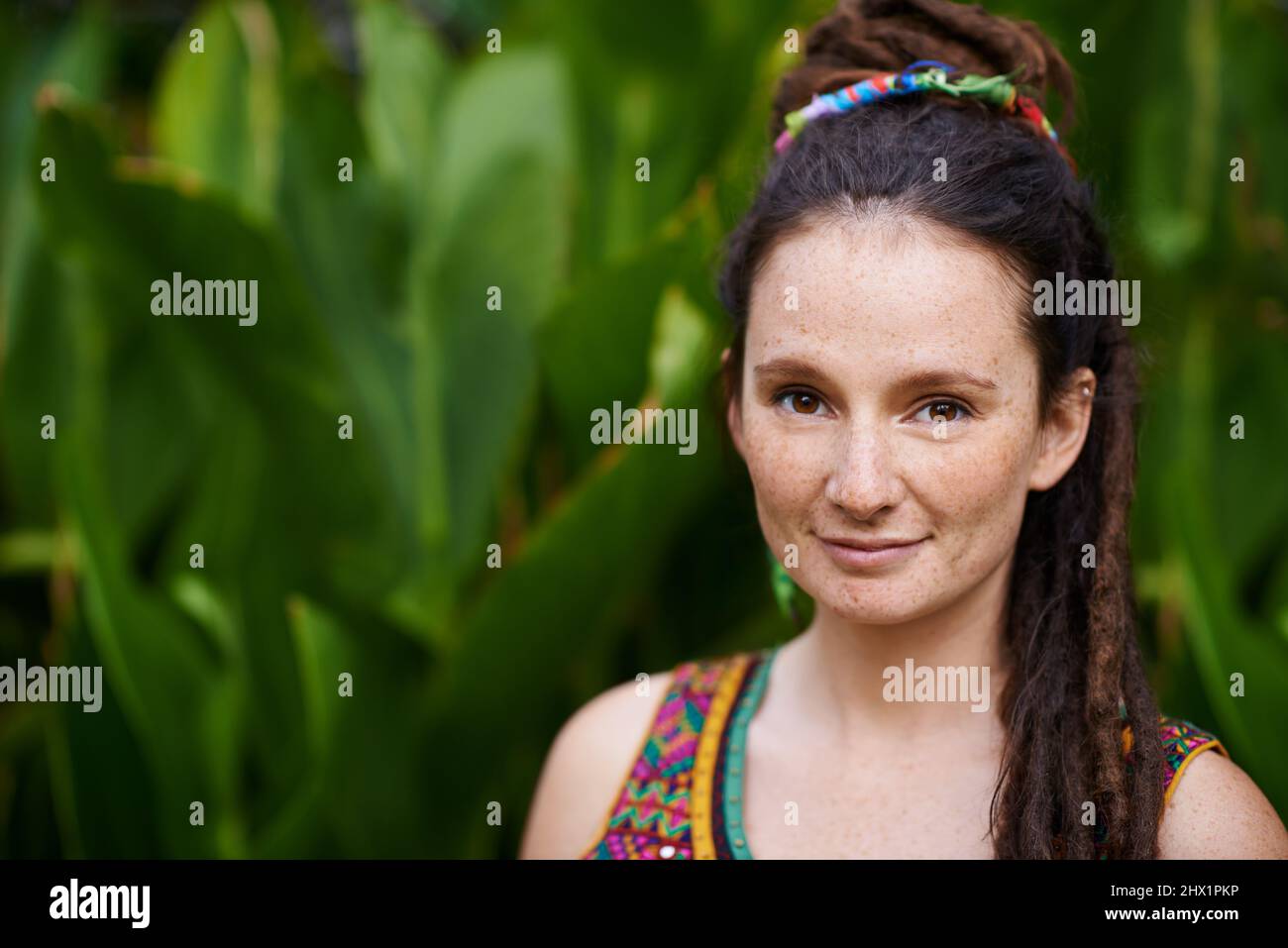 Living life her way. Portrait of a young hippie woman outdoors. Stock Photo