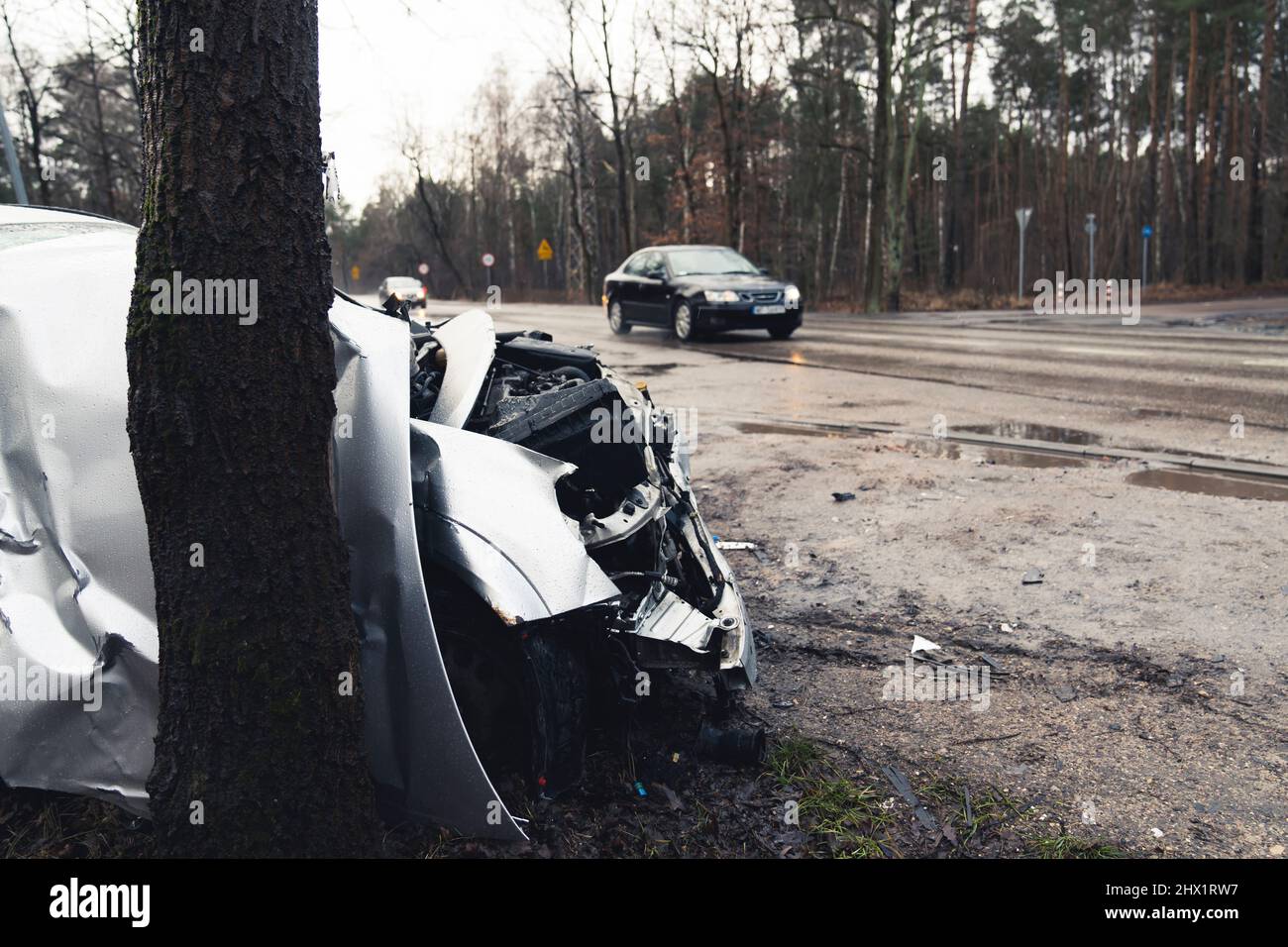 Bygone abandoned accident wreck car on the sides of woods . High quality photo Stock Photo