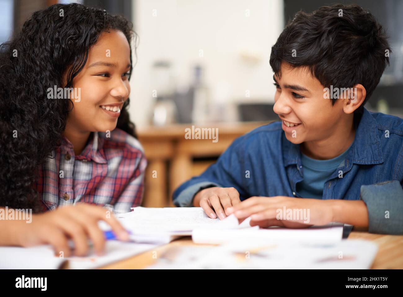 Getting a bit of after class help. Shot of two young students studying ...