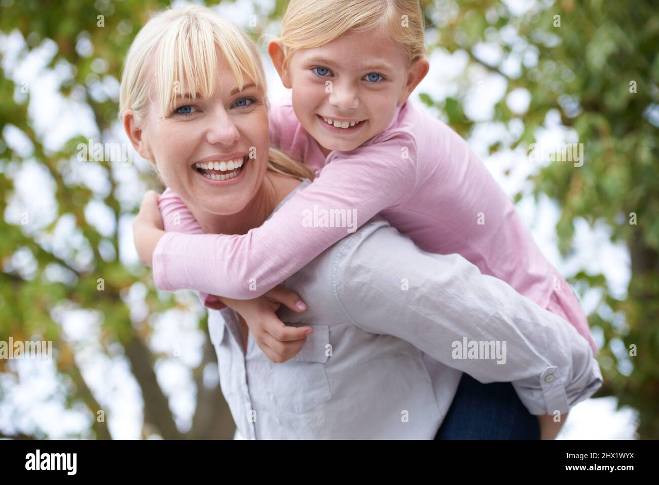 Woman Giving Little Boy Piggyback Ride Stock Photo, Picture and Royalty  Free Image. Image 10112006.