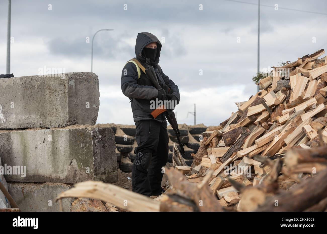KYIV, UKRAINE - Mar. 08, 2022: War in Ukraine. Territorial defense on one of checkpoints in Kyiv region. Russian forces have invaded Ukraine on 24th February. Stock Photo