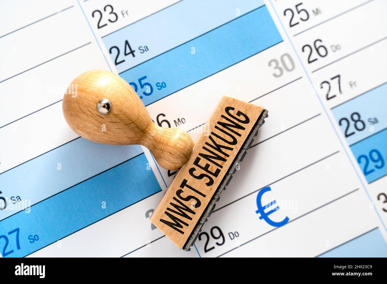 Wooden Stamp On A Calendar With The Inscription VAT Value Added Tax, Sales Tax Reduction, Adjustment Of The Tax To The Current Inflation PHOTOMONTAGE Stock Photo