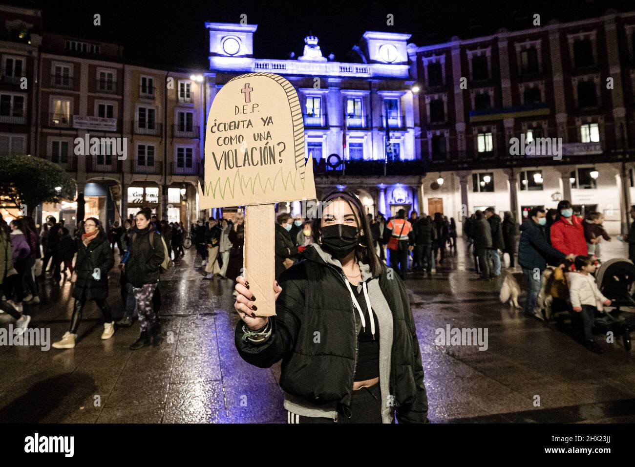 Burgos, Spain. 08th Mar, 2022. A protester holds a placard reading 'R.I.P. Does it already count as rape?' during the International Women's Day demonstration in Burgos. Thousands of demonstrators march through the streets of Burgos on the occasion of International Women's Day in a massive protest against women inequality. Credit: SOPA Images Limited/Alamy Live News Stock Photo