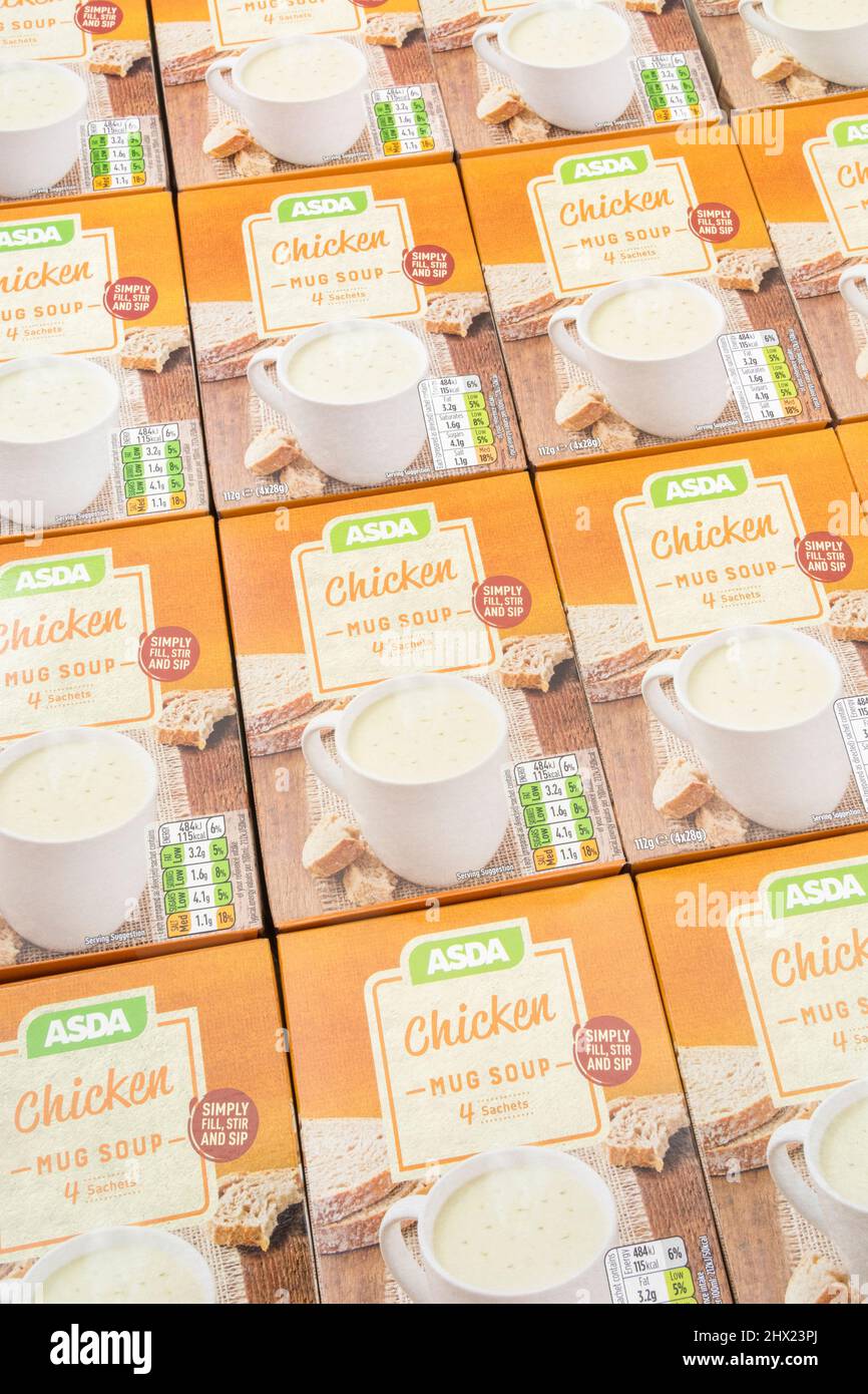 Neatly aligned ASDA own-label instant chicken soup in card boxes. For UK supermarket brand wars, ASDA logo, cup soups, own brand food. Stock Photo