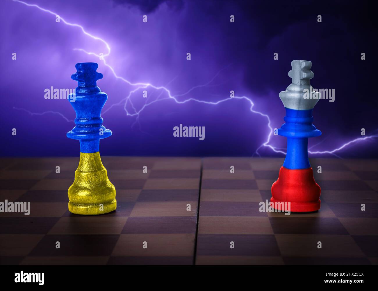 Game board with chess pieces in colors of Ukrainian and Russian flags  against dark background with lightning. Russia vs Ukraine war Stock Photo -  Alamy