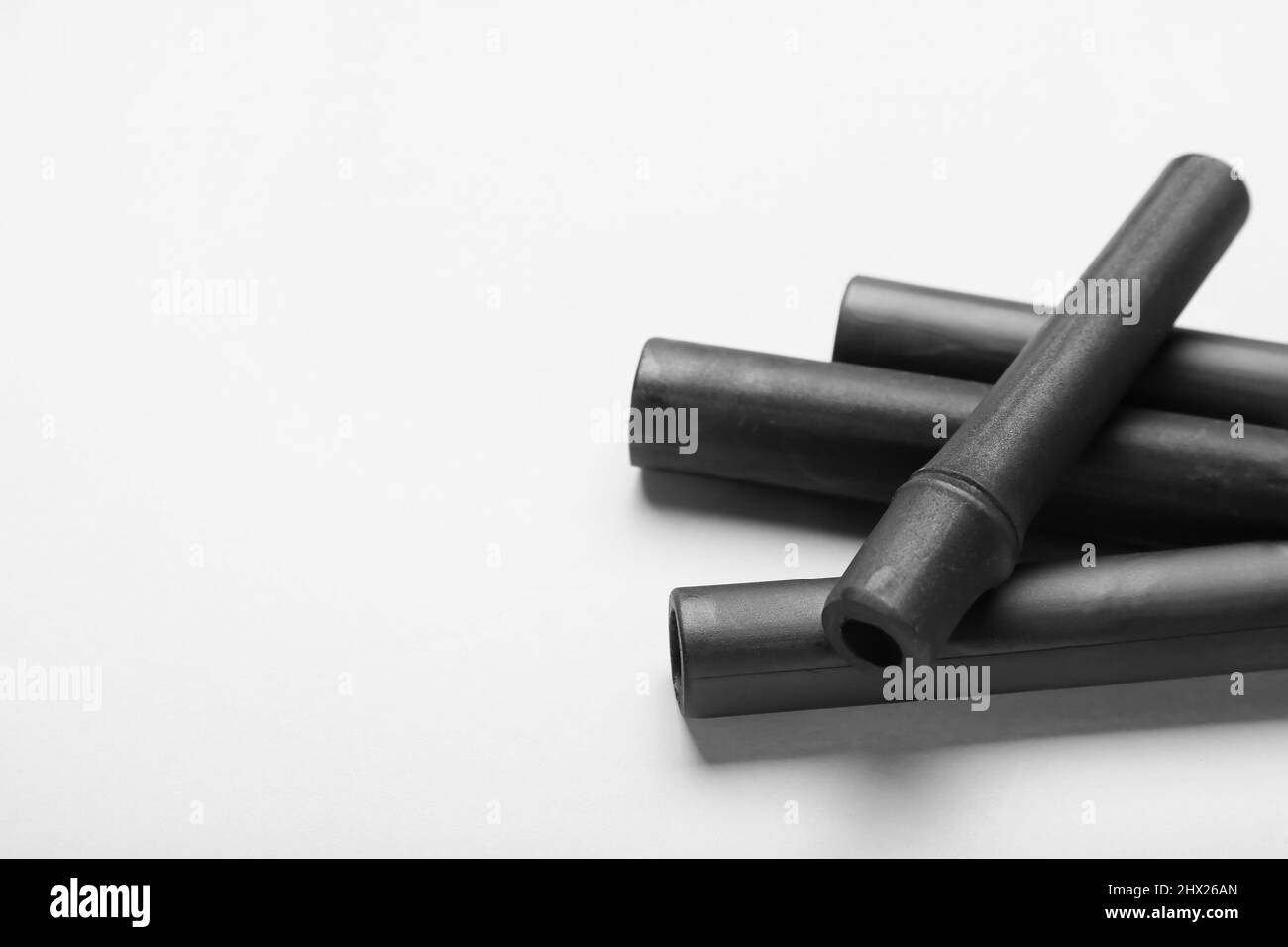 Black bamboo sticks on white background, closeup Stock Photo Alamy