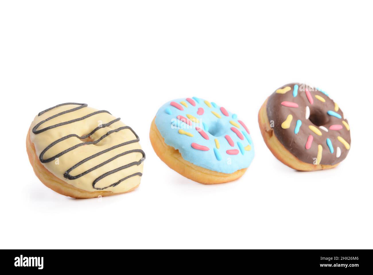 Different sweet donuts on white background Stock Photo - Alamy