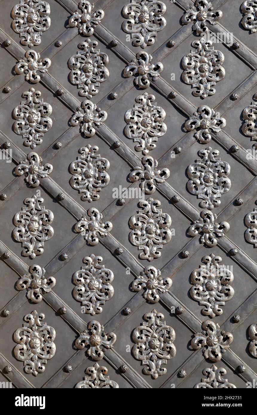 Old ornate metal door background Stock Photo