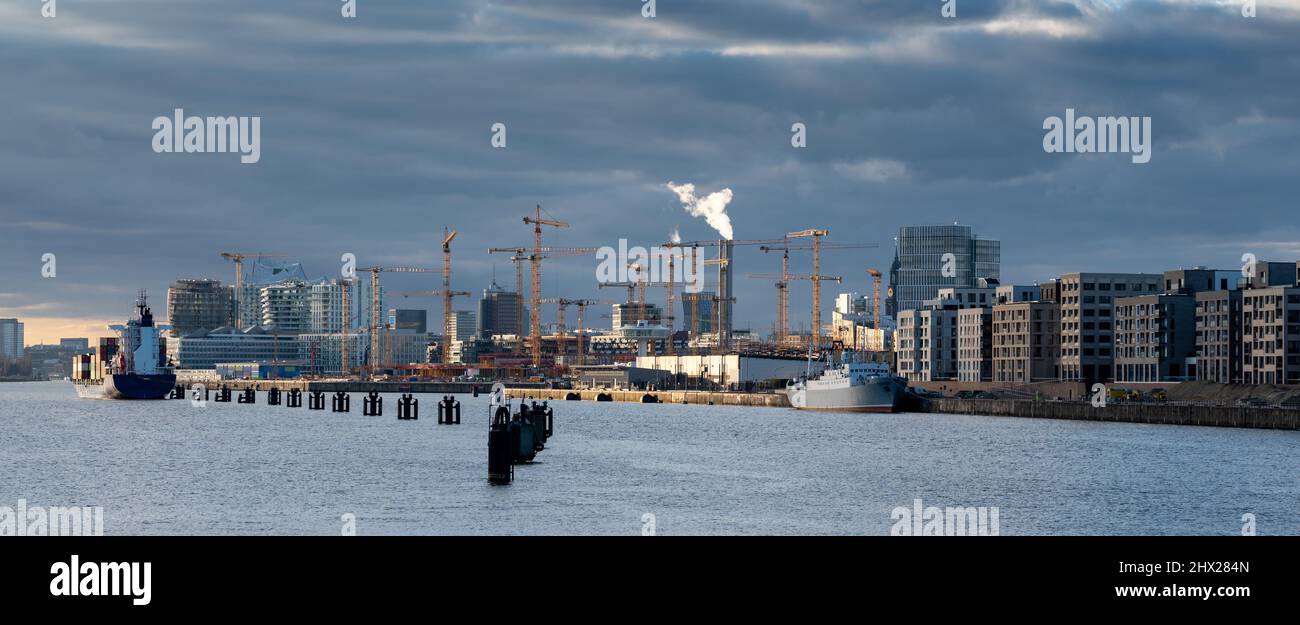 The new district Hafencity during sunset. Picture taken from the Freihafenelbbruecke bridge in Hamburg, Germany. Stock Photo