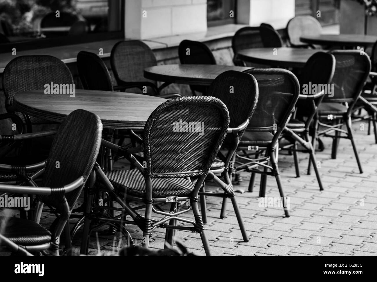 city cafe in the center with empty tables and chairs Stock Photo