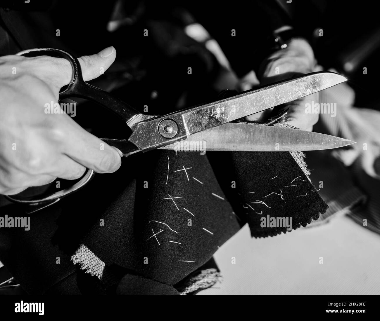Tailor designing Black and White Stock Photos & Images - Alamy