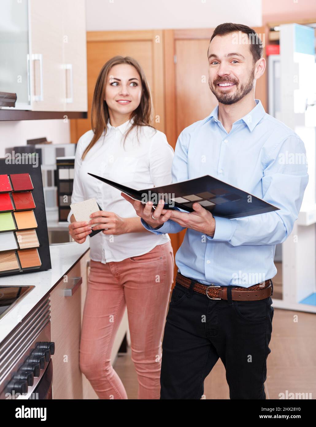 Salesman working in kitchen furniture shop Stock Photo Alamy