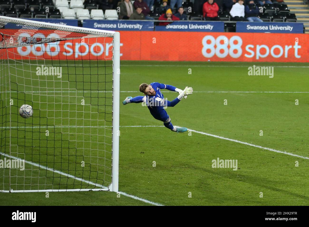 Andy Fisher, the goalkeeper of Swansea City is beat as Neco Williams of Fulham (not pictured) volley’s from long range to score his teams 5th goal. EFL Skybet championship match, Swansea city  v Fulham at the Swansea.com Stadium in Swansea on Tuesday 8th March 2022. this image may only be used for Editorial purposes. Editorial use only, license required for commercial use. No use in betting, games or a single club/league/player publications. pic by  Andrew Orchard/Andrew Orchard sports photography/Alamy Live news Stock Photo