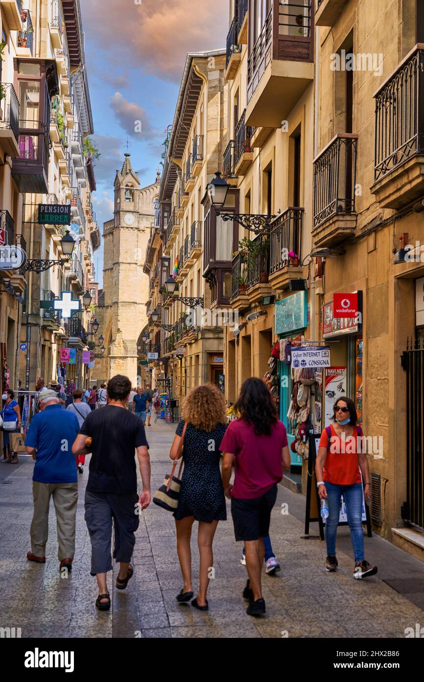 Tourists walking in the Old Town, in the background San Vicente Church, Donostia, San Sebastián, Gipuzkoa, Basque Country, Spain, Europe, Going into Stock Photo