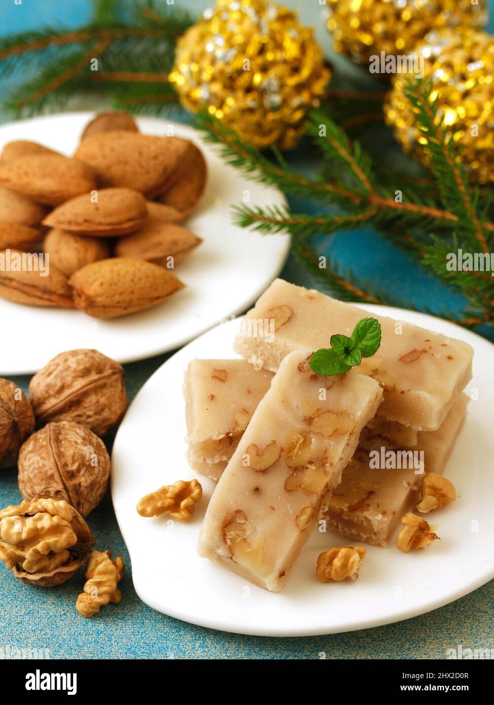 Turrón de mazapán y nueces. Marzipan nougat with walnuts. Typical dessert from Spain for Christmas. Stock Photo