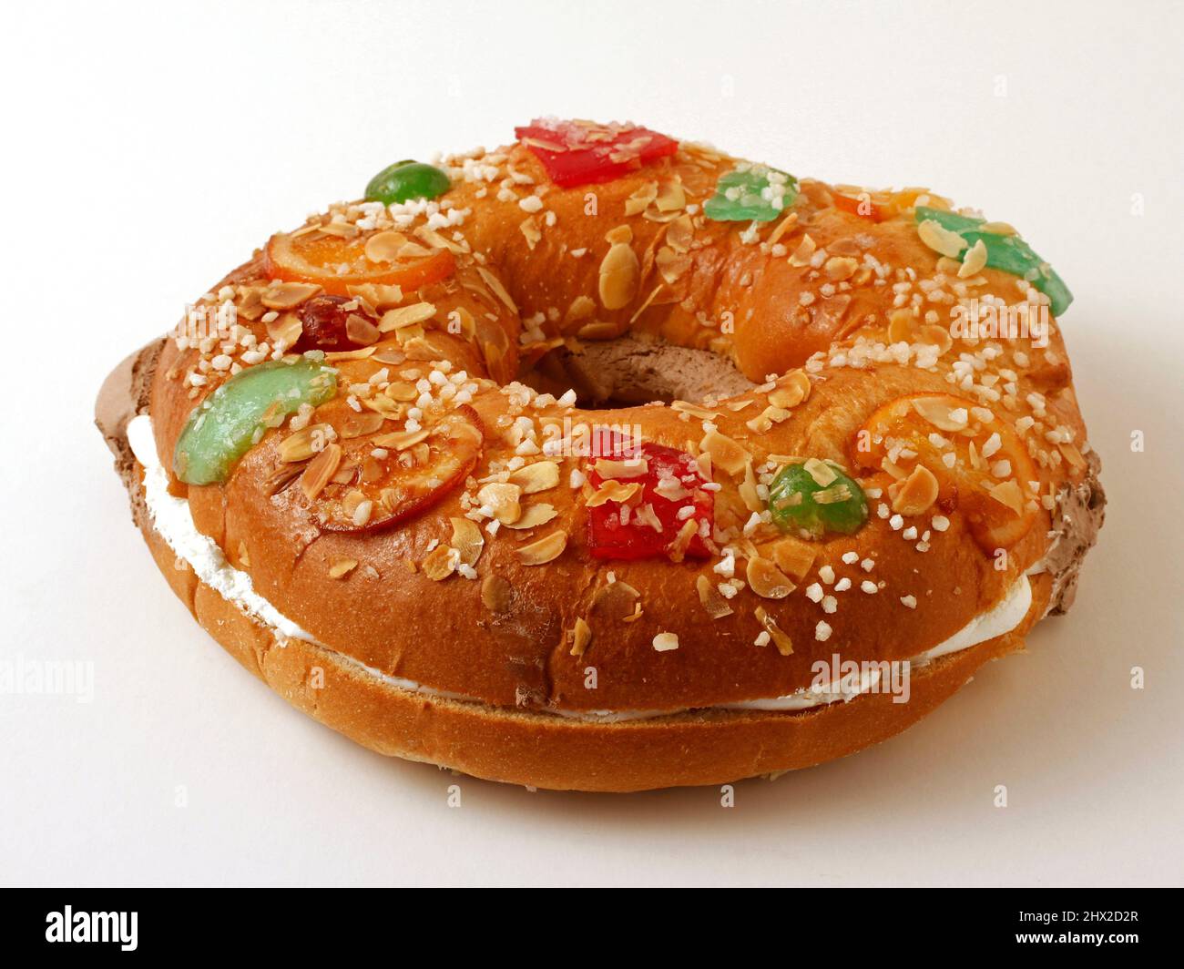 Roscón de Reyes with cream and chocolate. Typical hispanic pastry. Stock Photo